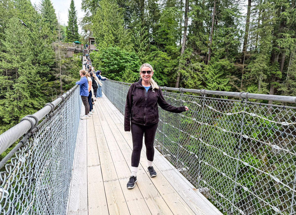 Eleanor and some tourists are on a suspension bridge.