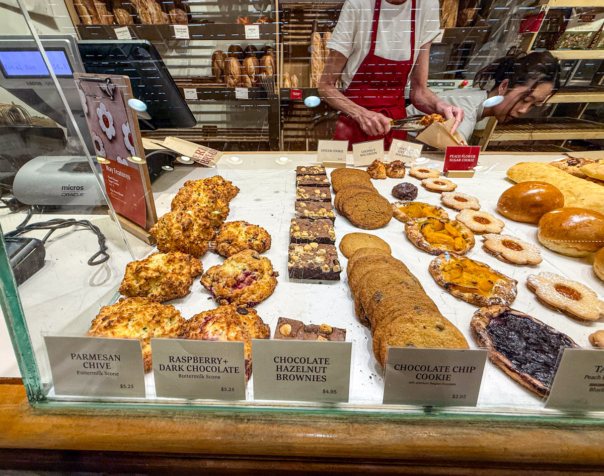 Different kinds of pastries such as brownies, cookies, and scones.
