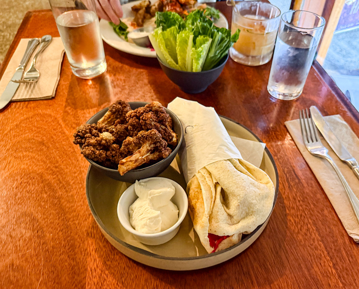 A plate full of Lebanese food, including pita and hummus.
