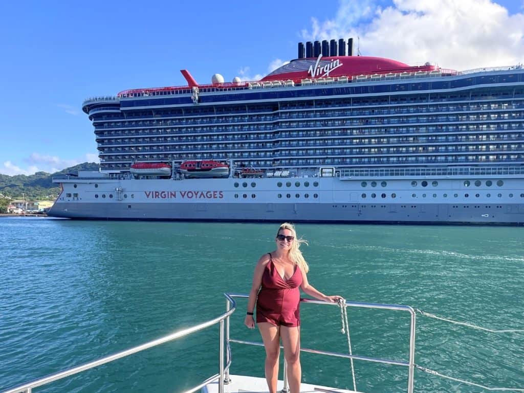 Eleanor in front of Virgin Voyages Resilient Lady in Castries, St. Lucia