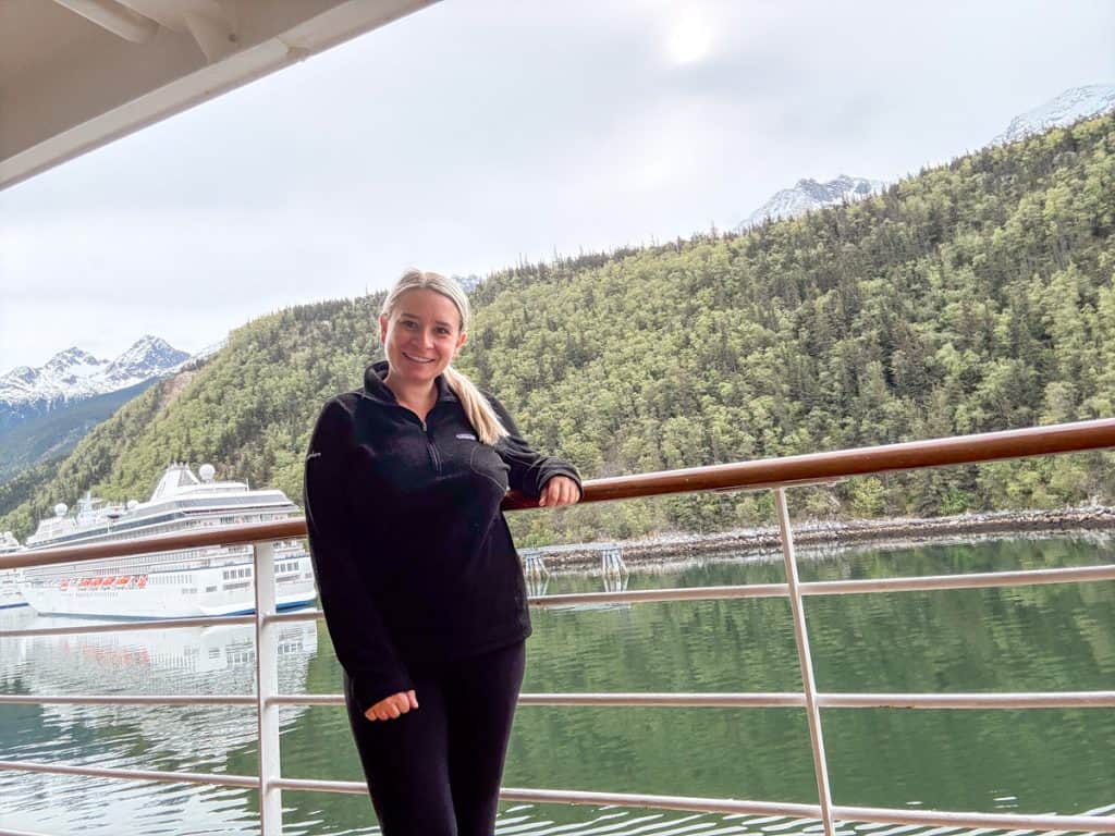 Eleanor is wearing a fleece jacket on a cruise.