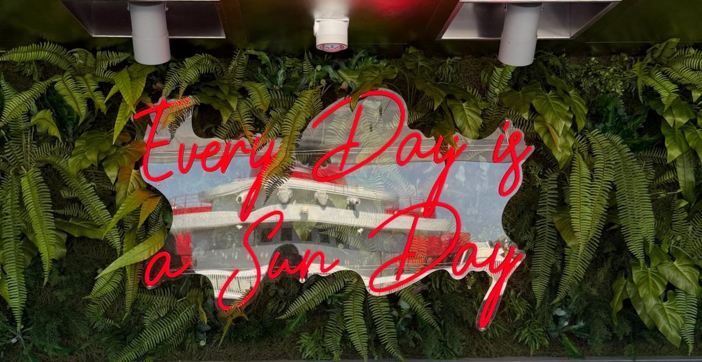 Photo of a sign that says "Every Day is a Sun Day" on Brilliant Lady