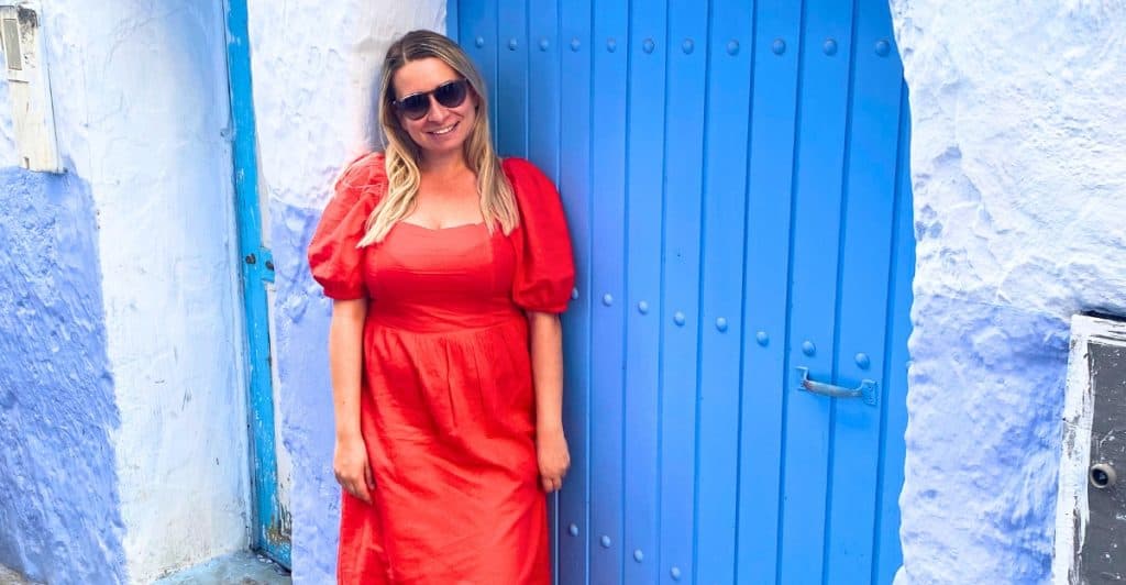 Photo of Eleanor wearing a bright red long dress in Morocco