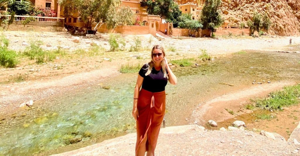 Photo of Eleanor wearing a black tee shirt with long brown skirt in Morocco.